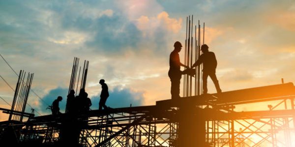 Silhouette of engineer and construction team working at site over blurred background sunset pastel for industry background with Light fair.Create from multiple reference images together.